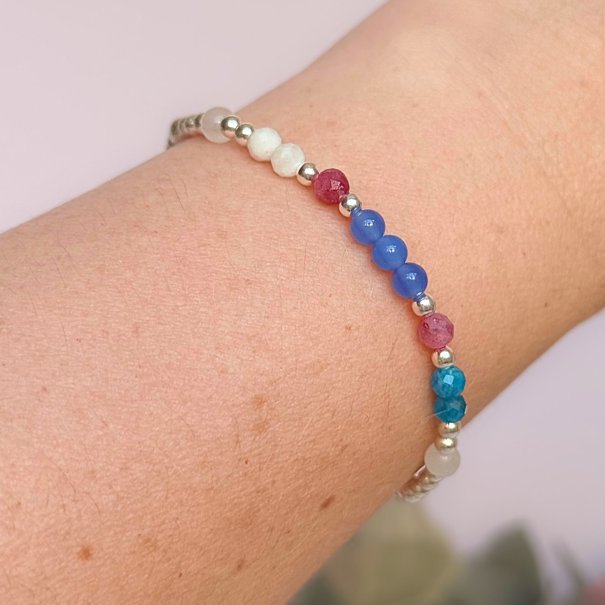 ‘Santorini' sterling silver dainty beaded bracelet with pink tourmaline, rainbow moonstone, blue agate, apatite and white jade. Made with round 3mm sterling silver beads and 4mm smooth and faceted round crystal gemstone beads. Pictured being worn