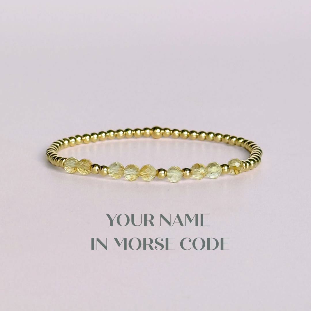 Morse code secret message bracelet spelling out your chosen name in gold filled and citrine crystal beads. Elasticated with 4mm faceted citrine beads and 3mm gold filled beads. Custom November birthstone bracelet.