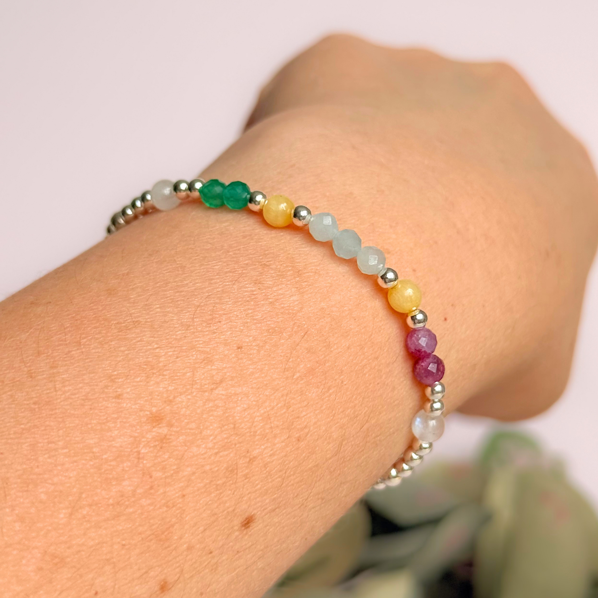 'Amalfi Coast' sterling silver dainty beaded bracelet with green agate, yellow calcite, pink tourmaline, aquamarine and moonstone. Made with round 3mm sterling silver beads and 4mm smooth and faceted round crystal gemstone beads. Pictured being worn, at an angle