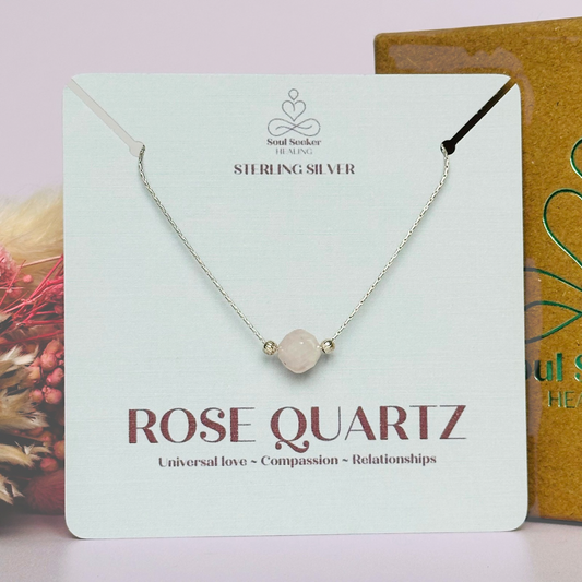 Rose quartz necklace featuring an 8mm star cut rose quartz bead with corrugated sterling silver beads on a delicate sterling silver cardano beading chain. The necklace fastens with a subtle yet secure sterling silver bolt clasp.