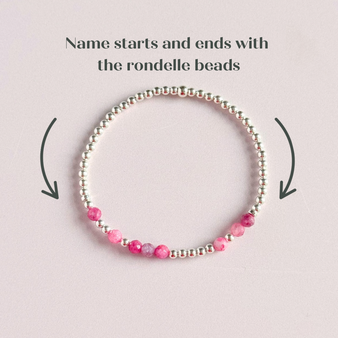 Morse code secret message bracelet spelling out your chosen name in sterling silver and pink tourmaline crystal beads. Elasticated with 4mm faceted pink tourmaline beads and 3mm sterling silver beads. Custom October birthstone bracelet.