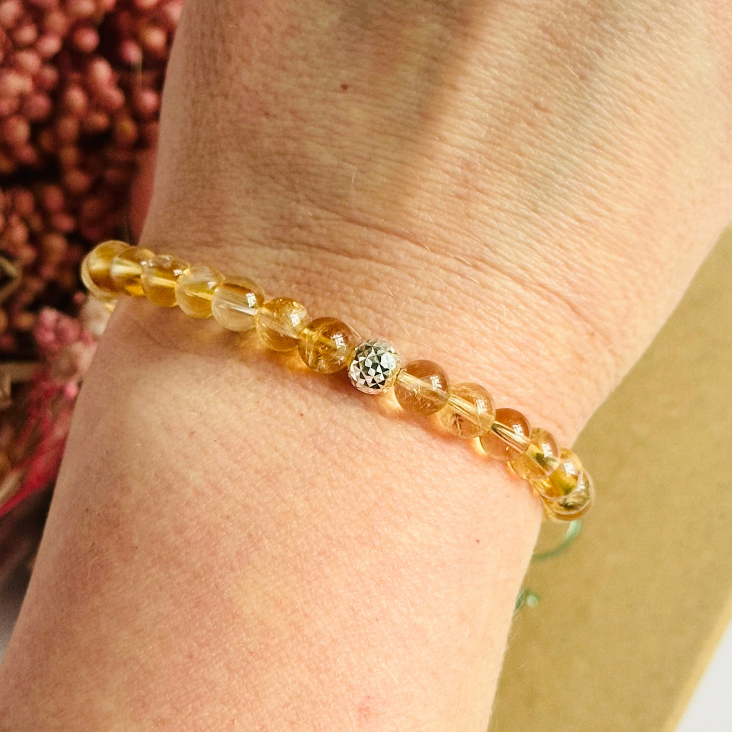 Citrine bracelet with a faceted sterling silver or gold vermeil focal bead. A bracelet to promote abundance and joy. Made with 6mm beads.