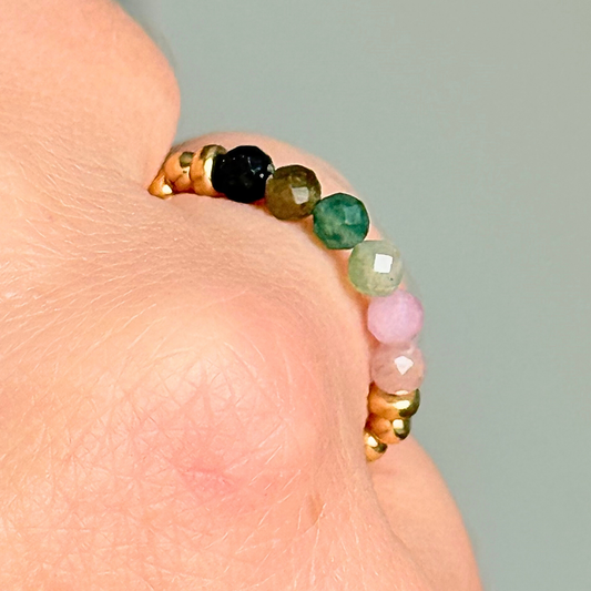 Gold vermeil band style ring with multicolour 3mm faceted mixed tourmaline beads in shades of pink, green and black, with a beaded band of 2.5 mm gold vermeil round beads. Elasticated for comfort.