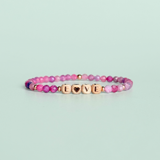Bracelet featuring 5mm engraved wooden beads which you can personalise with your choice of words, numbers and symbols. The main the band of the bracelet is made with 4mm faceted pink tourmaline round crystal gemstone beads. Finished with your choice of gold vermeil, sterling silver or rose gold vermeil accent beads.