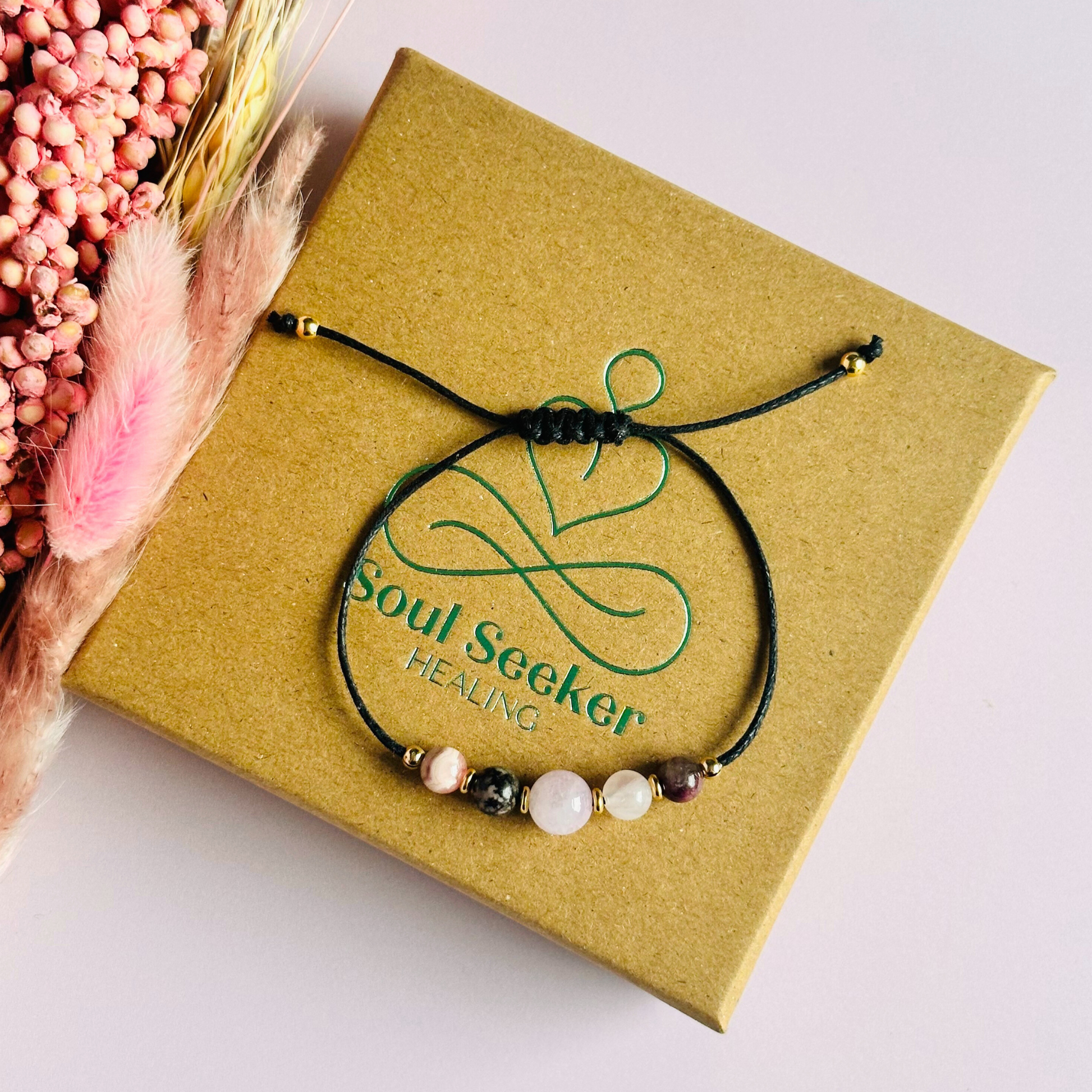 Cord bracelet made with five crystals all believed to help with self-love. Including kunzite, rubellite, rose quartz, rhodonite and rhodochrosite. With your choice of cord colour and choice of either sterling silver, gold vermeil or rose gold vermeil accent beads. Vegan friendly waxed cotton cord.