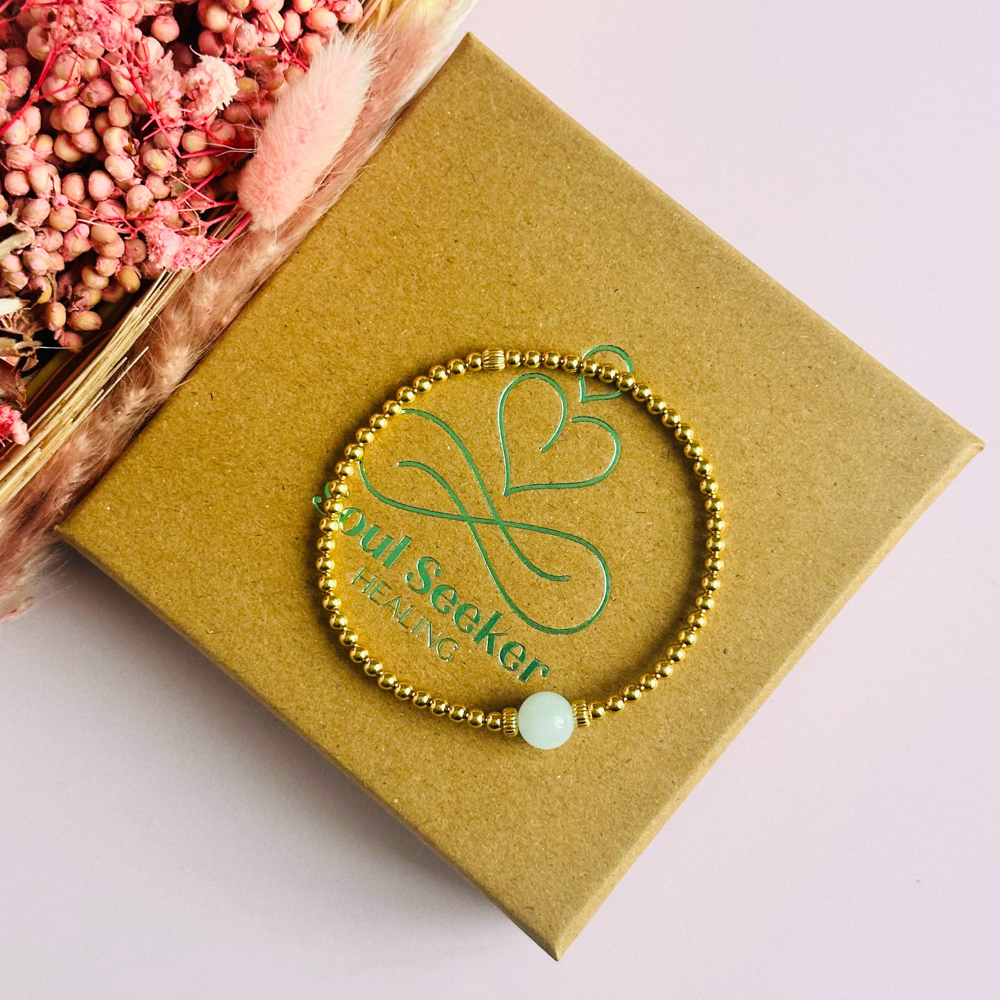 Gold vermeil aquamarine bracelet features an ethically mined 8mm aquamarine bead, flanked by corrugated rondelle beads on a band of 3mm gold vermeil beads. A bracelet to promote courage and self expression.