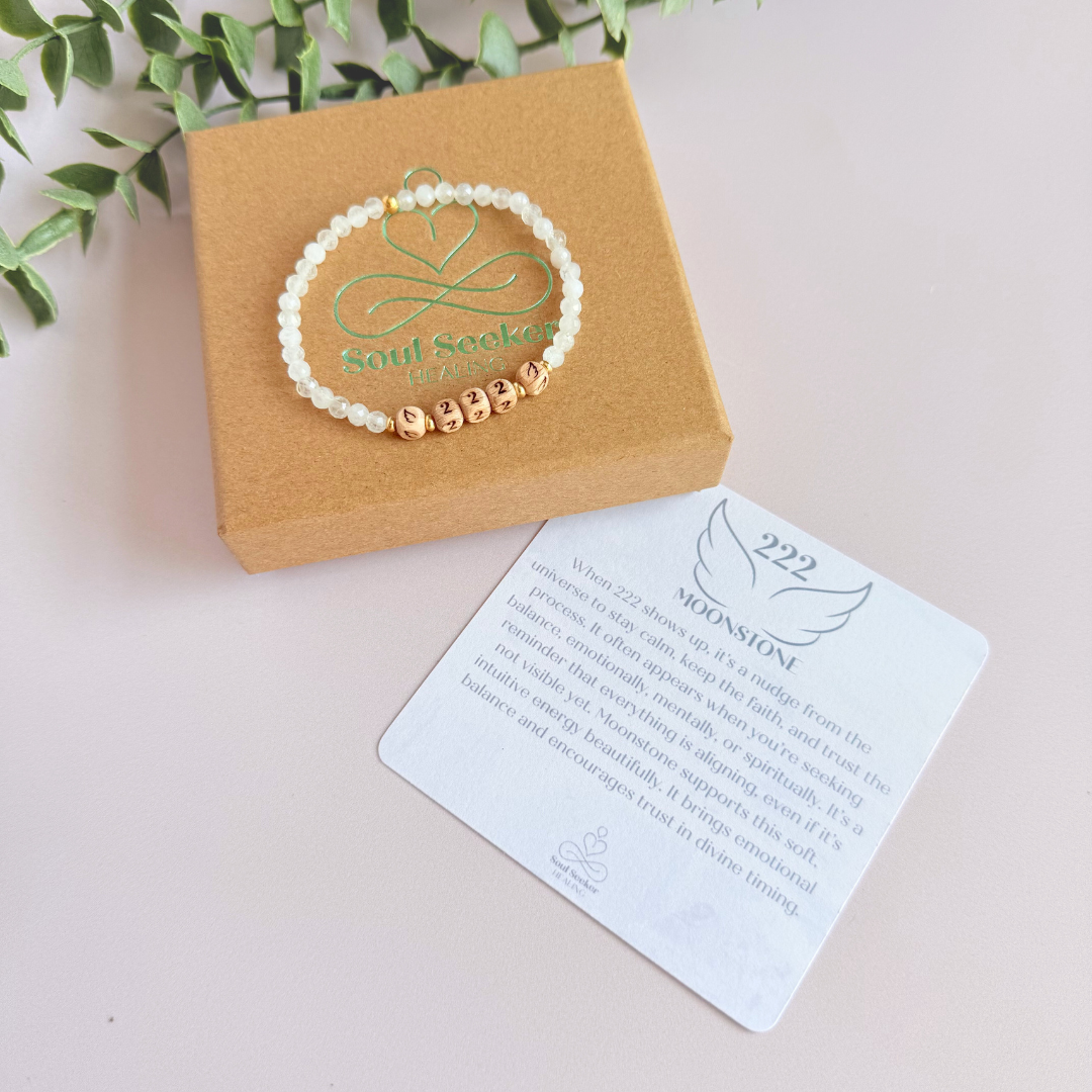 Bracelet featuring engraved wooden 222 angel number and wing beads, on the band of 4mm faceted moonstone round crystal gemstone beads. Finished with your choice of gold vermeil, sterling silver or rose gold vermeil accent beads.