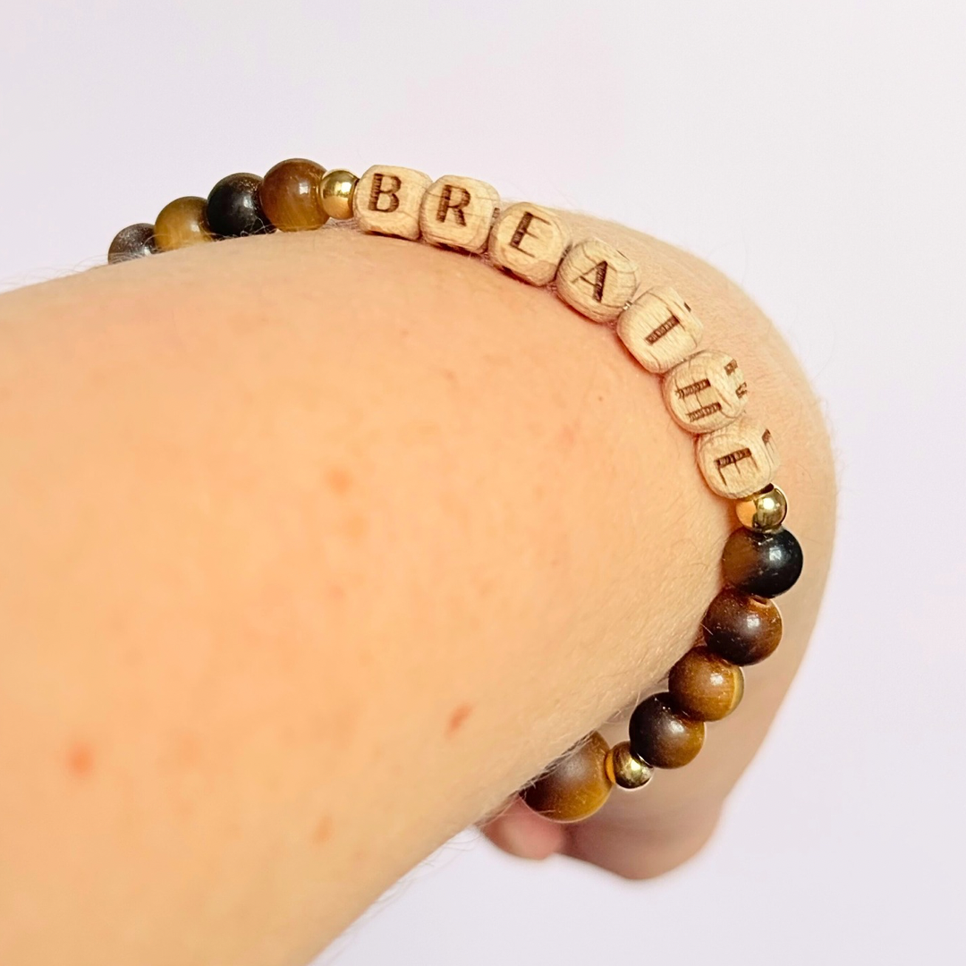Breathwork bracelet featuring 6mm and 8mm frosted tigers eye crystal beads that follow the 4-7-8 counted breathing method. Also featuring laser engraved wooden letter beads spelling out the word BREATHE. Choose your accent beads from rose gold vermeil, gold vermeil or sterling silver.