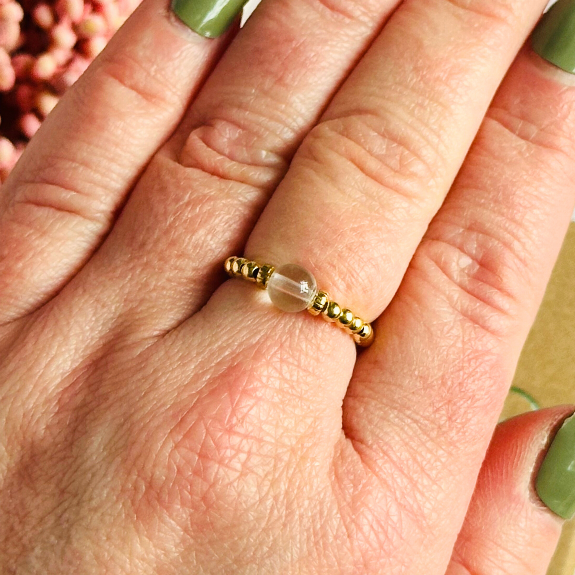 This gold vermeil clear quartz ring features a 6mm round ethically sourced clear quartz bead, surrounded by gold vermeil corrugated rondelle beads and delicate 2.5mm gold vermeil beads. April birthstone ring.