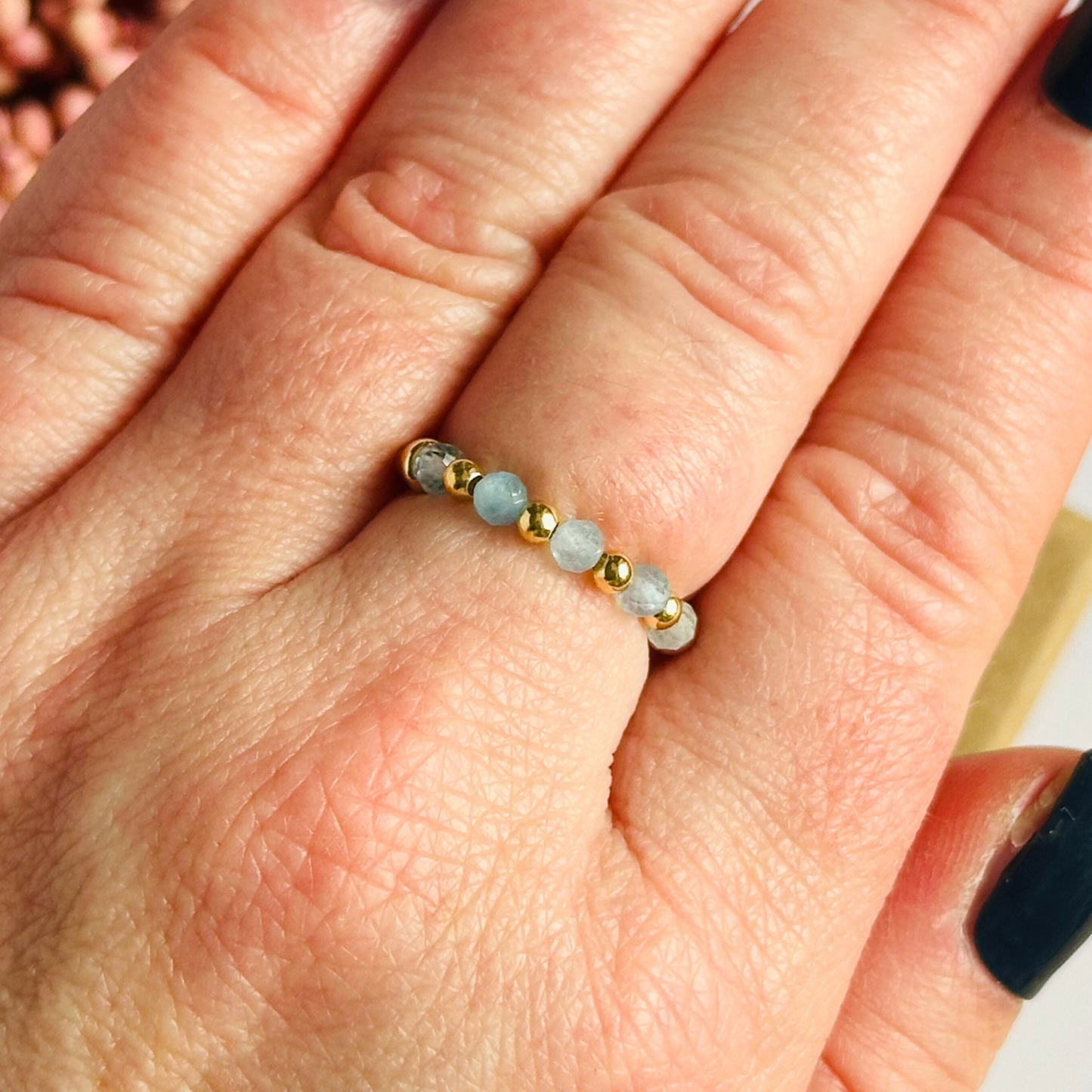 Gold vermeil aquamarine ring featuring five 3mm faceted round aquamarine beads on a elasticated ring band of 2.5mm gold vermeil beads. March birthstone ring.