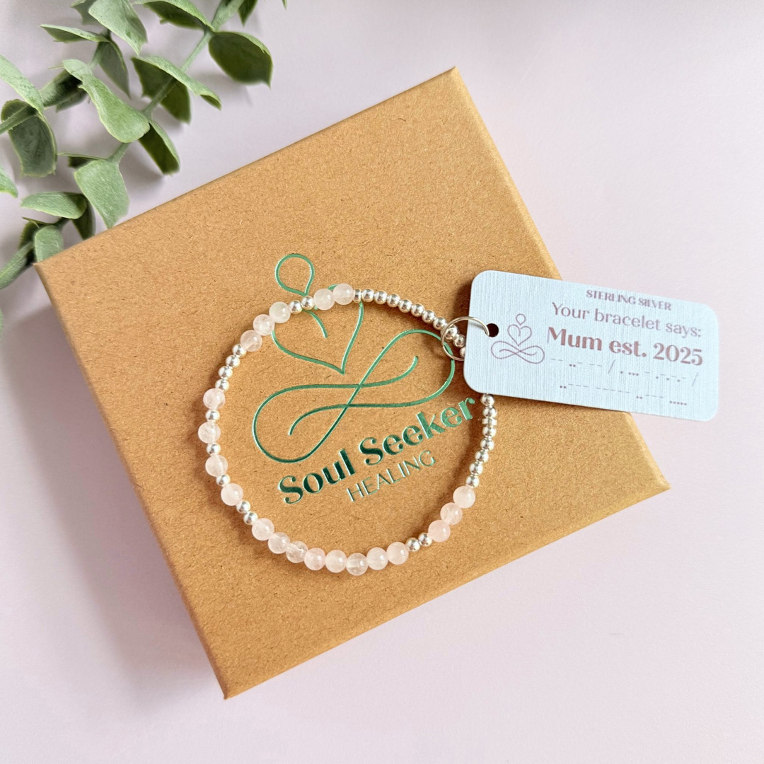 Morse code secret message bracelet spelling out the words Mum est. 2025 in sterling silver and rose quartz crystal beads. elasticated with 4mm rose quartz beads and 3mm sterling silver beads.