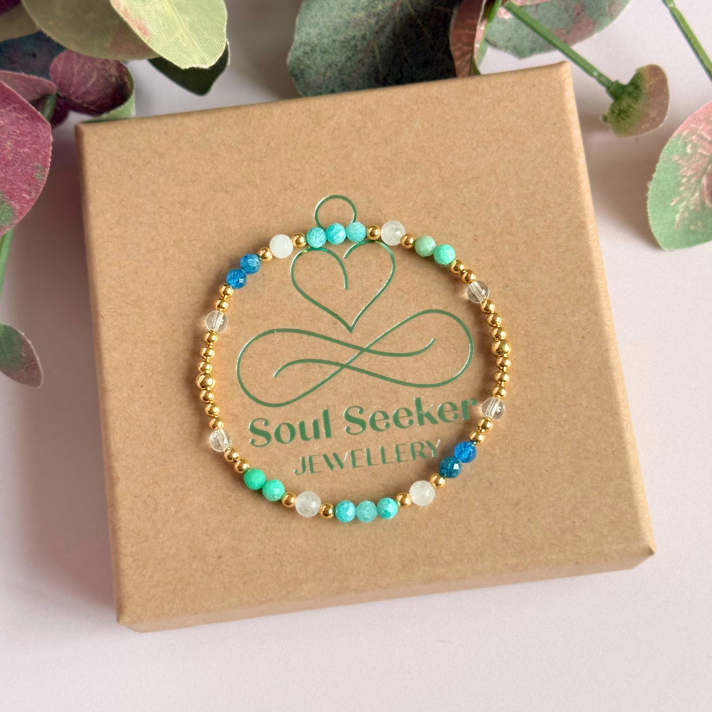 ‘Caribbean Dream' gold vermeil dainty beaded bracelet with white jade, chrysoprase, amazonite, apatite and clear quartz. Made with round 3mm gold vermeil beads and 4mm smooth and faceted round crystal gemstone beads. Pictured on top of the box 