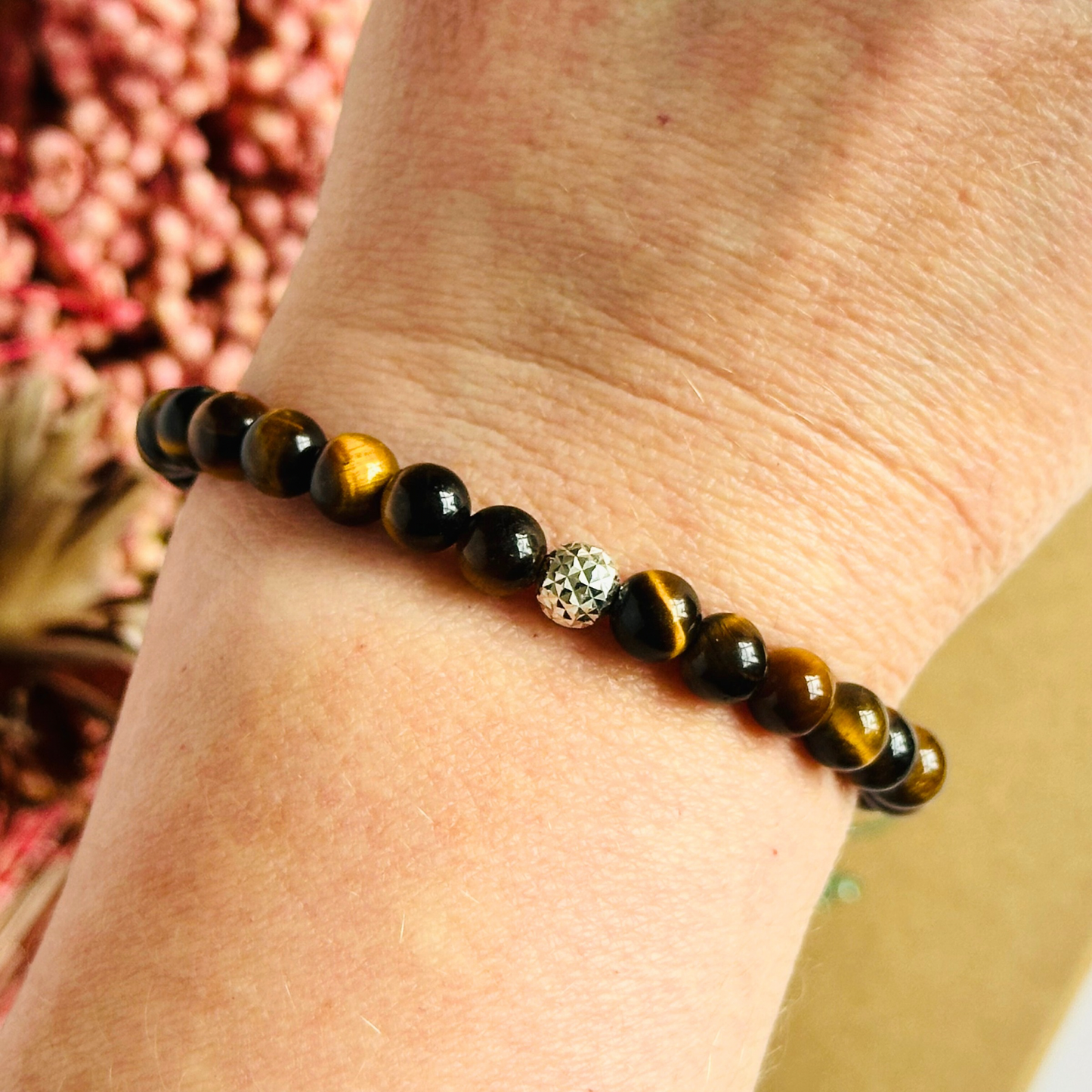 Tigers Eye bracelet featuring 6mm smooth tiger eye beads. With your choice of gold vermeil or sterling silver faceted accent beats.