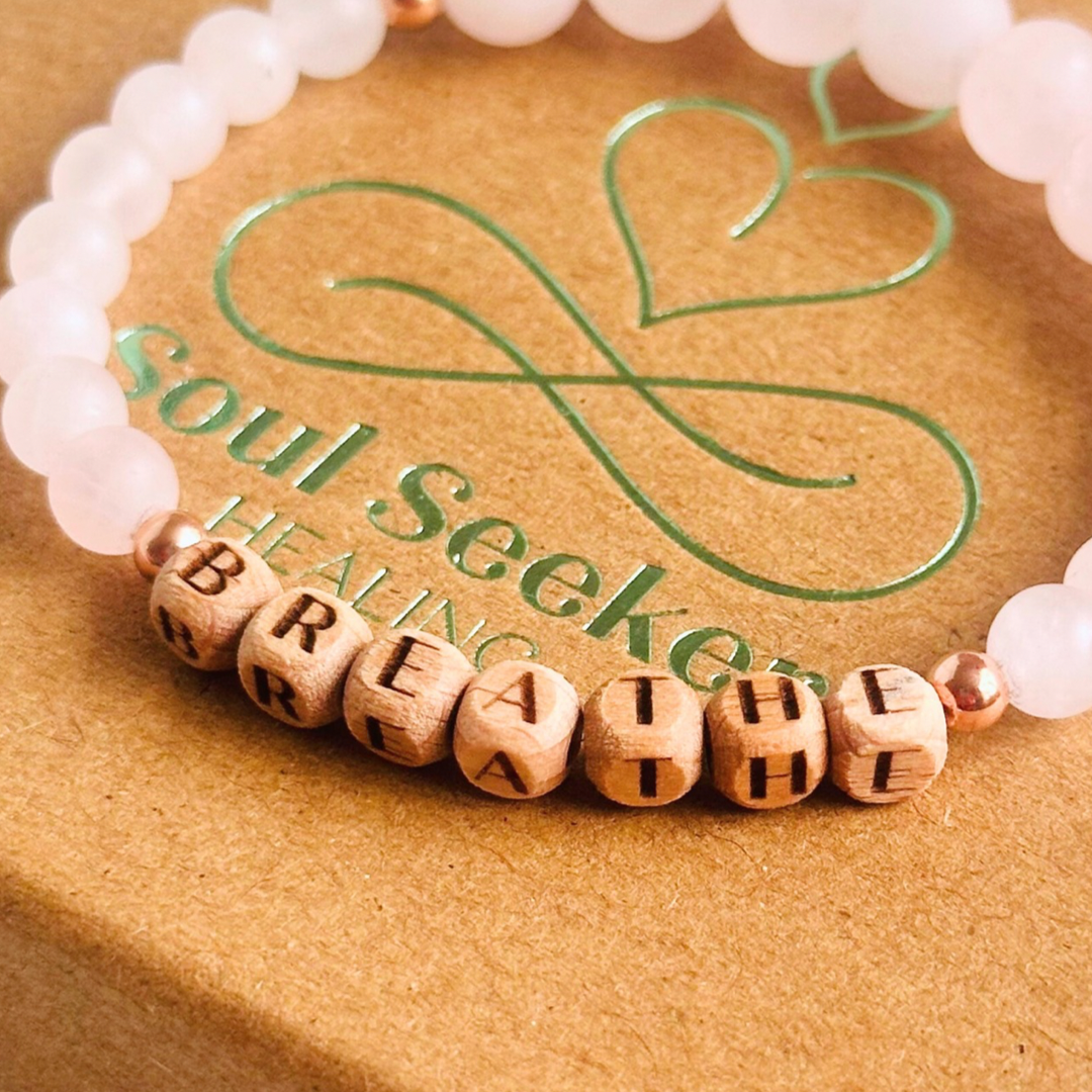 Breathwork bracelet featuring 6mm and 8mm frosted rose quartz crystal beads that follow the 4-7-8 counted breathing method. Also featuring laser engraved wooden letter beads spelling out the word BREATHE. Choose your accent beads from rose gold vermeil, gold vermeil or sterling silver.
