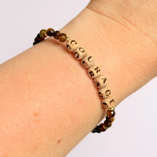 Bracelet featuring 5mm engraved wooden beads, which you can personalise with your choice of words, numbers and symbols. The main the band of the bracelet is made with 4mm faceted tigers eye round crystal gemstone beads. Finished with your choice of gold vermeil, sterling silver or rose gold vermeil accent beads.