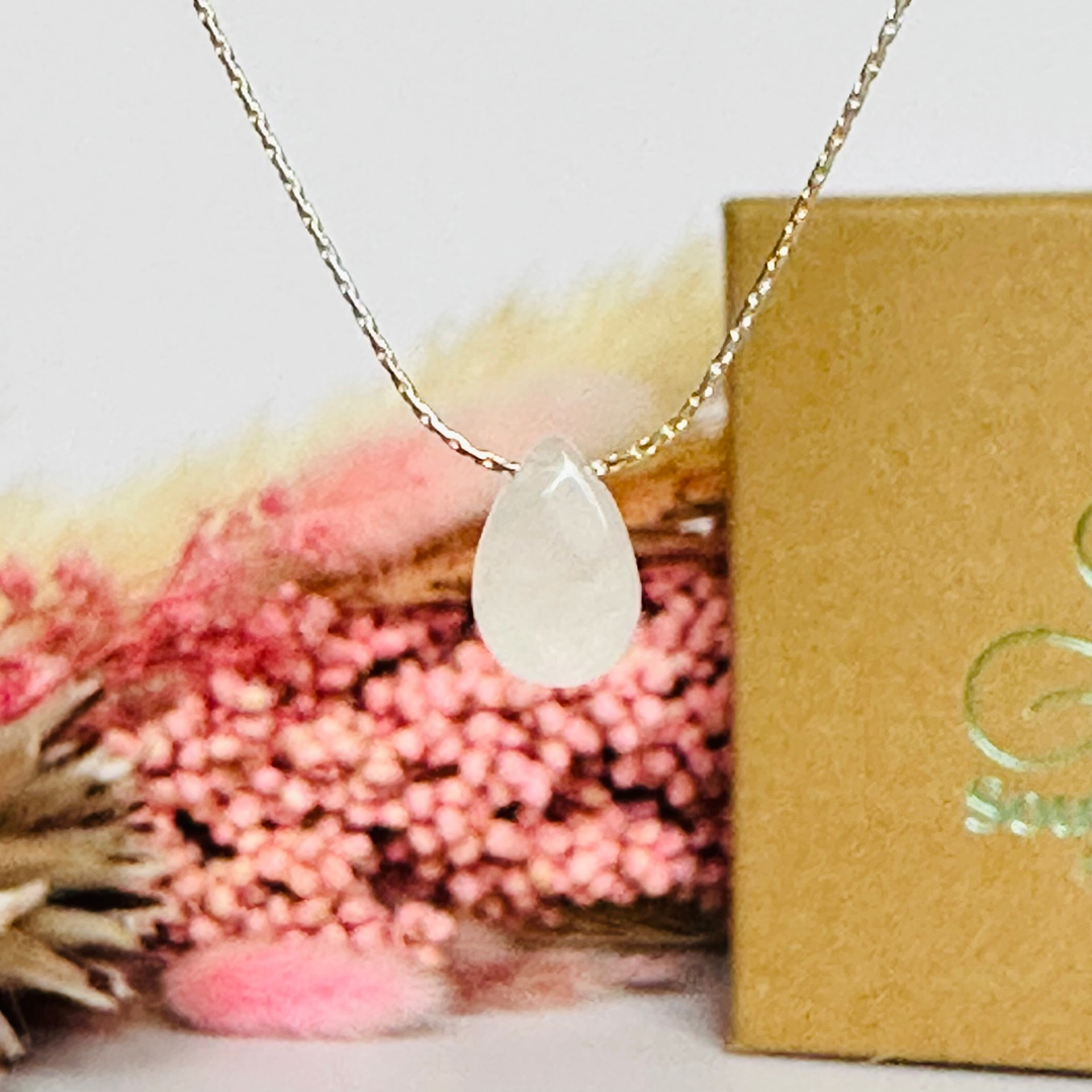 Dainty rose quartz teardrop necklace featuring a 12x8mm faceted rose quartz teardrop bead on a fine sterling silver beading chain.