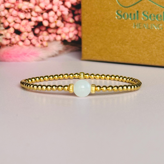 Gold vermeil moonstone bracelet features an ethically mined 8mm moonstone bead, flanked by corrugated rondelle beads on a band of 3mm gold vermeil beads. A bracelet to promote feminine energy and intuition.