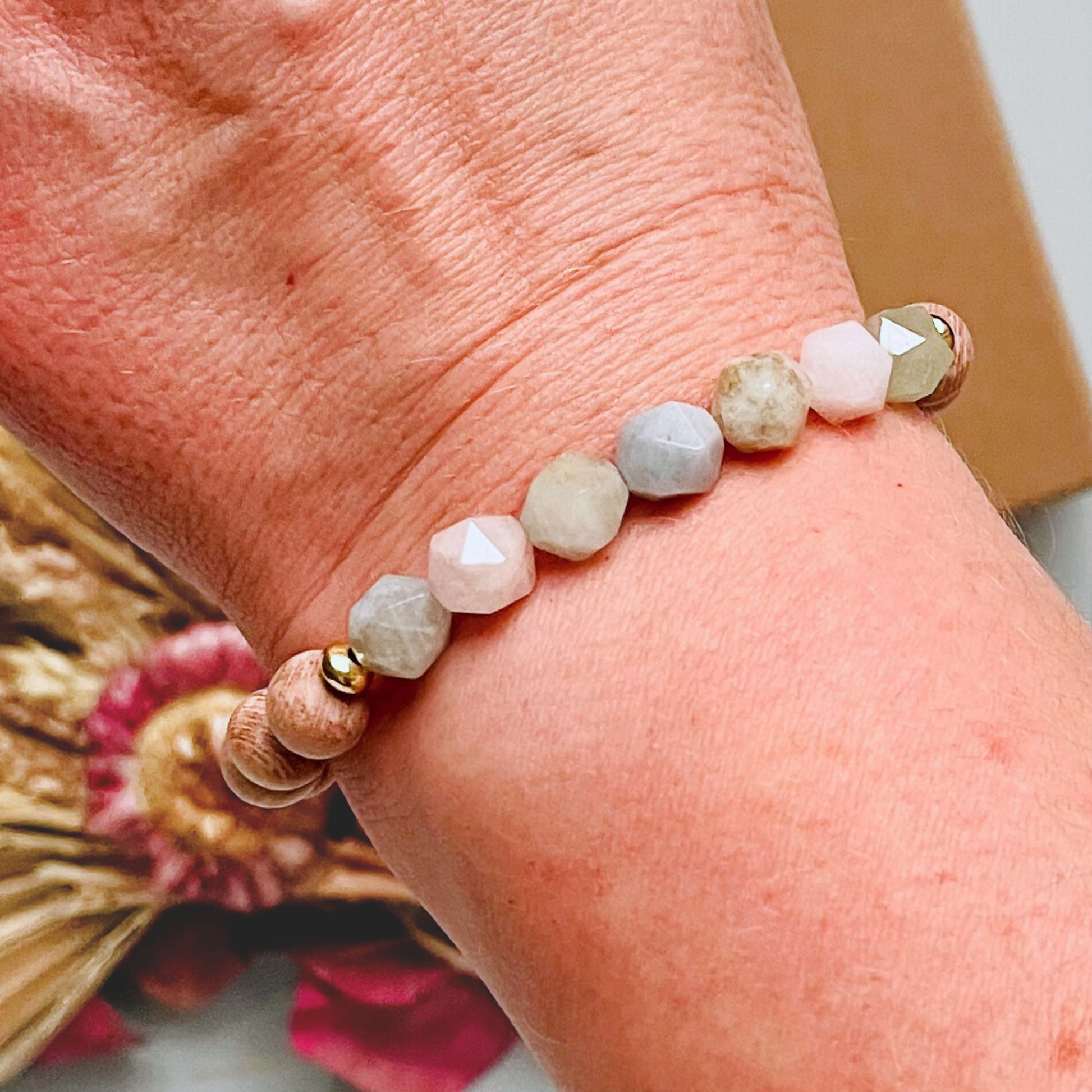 Morganite and raw rosewood elasticated essential oil diffuser bracelet. Made with 8mm star cut morganite beads, 8mm round raw rosewood beads and your choice of sterling silver, gold vermeil or rose gold vermeil spacer beads