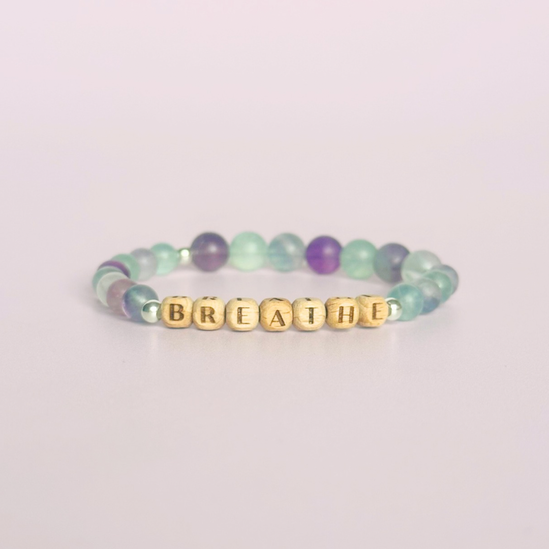 Breathwork bracelet featuring 6mm and 8mm frosted rainbow fluorite crystal beads that follow the 4-7-8 counted breathing method. Also featuring laser engraved wooden letter beads spelling out the word BREATHE. Choose your accent beads from rose gold vermeil, gold vermeil or sterling silver.