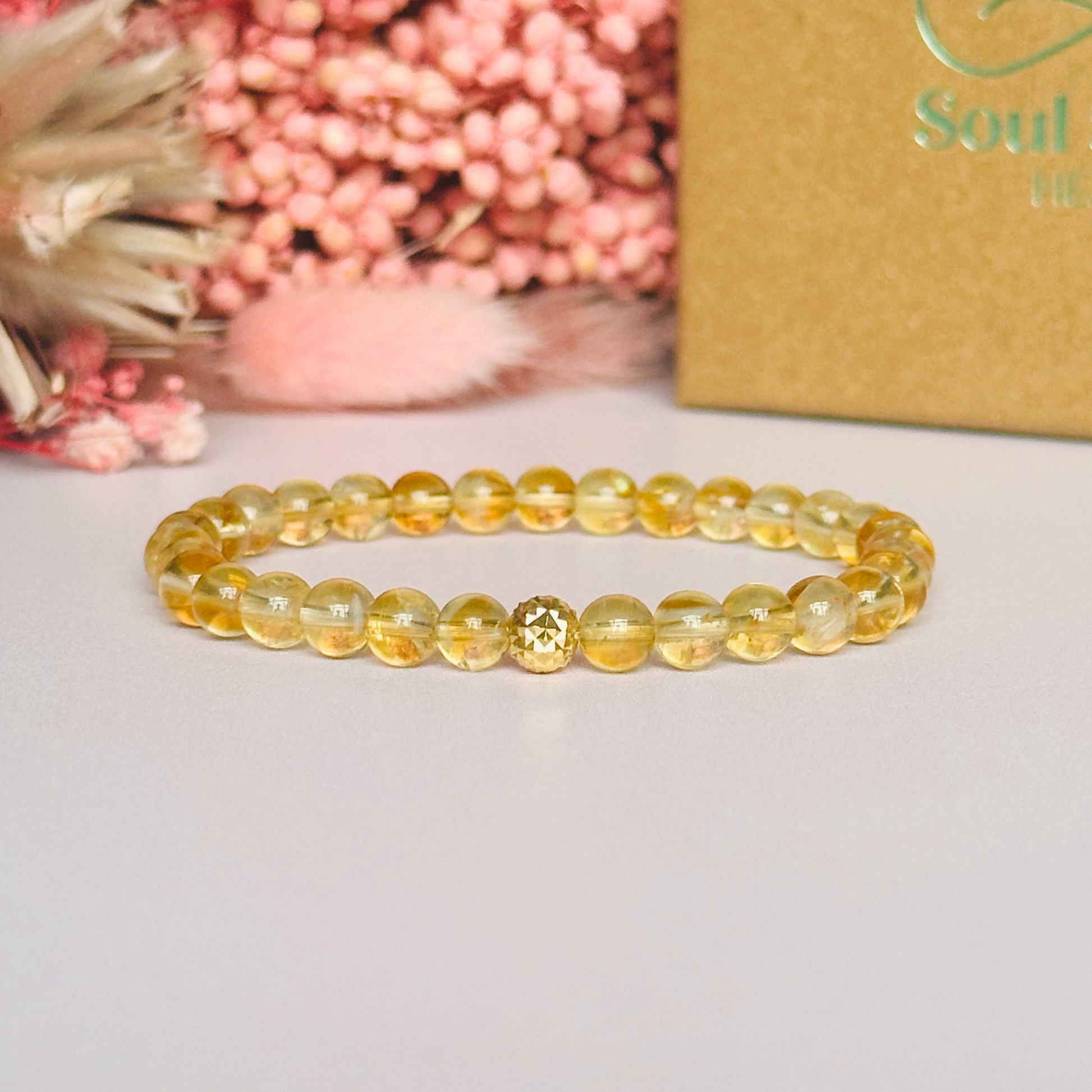 Citrine bracelet with a faceted sterling silver or gold vermeil focal bead. A bracelet to promote abundance and joy. Made with 6mm beads.