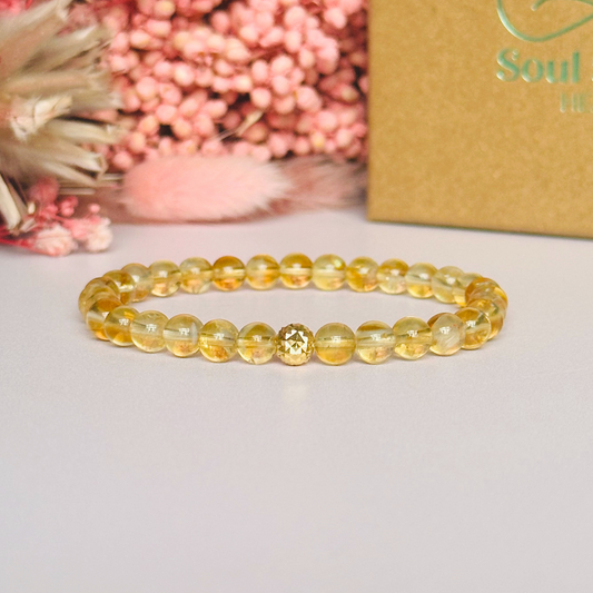 Citrine bracelet with a faceted sterling silver or gold vermeil focal bead. A bracelet to promote abundance and joy. Made with 6mm beads.