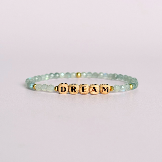 Bracelet featuring 5mm engraved wooden beads, which you can personalise with your choice of words, numbers and symbols. The main the band of the bracelet is made with 4mm faceted labradorite round crystal gemstone beads. Finished with your choice of gold vermeil, sterling silver or rose gold vermeil accent beads.