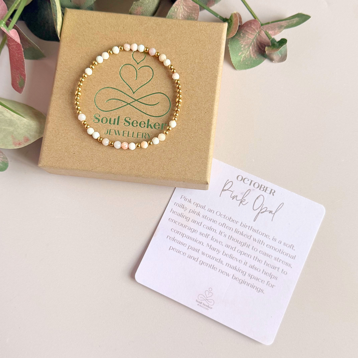 Dainty, minimalist gold vermeil and pink opal October birthstone stacking bracelet. Made with 4mm faceted pink opal beads and 3mm gold vermeil round beads. Elasticated for comfort. Pictured on top of the gift box