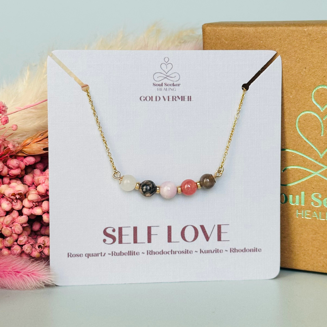 A dainty self love crystal necklace made with a selection of five healing crystals all believed to help promote self love. On a fine, gold vermeil figaro chain, which fastens with a gold vermeil bolt clasp. Featuring corrugated gold vermeil spacer beads and accented with daisy shaped bead caps.