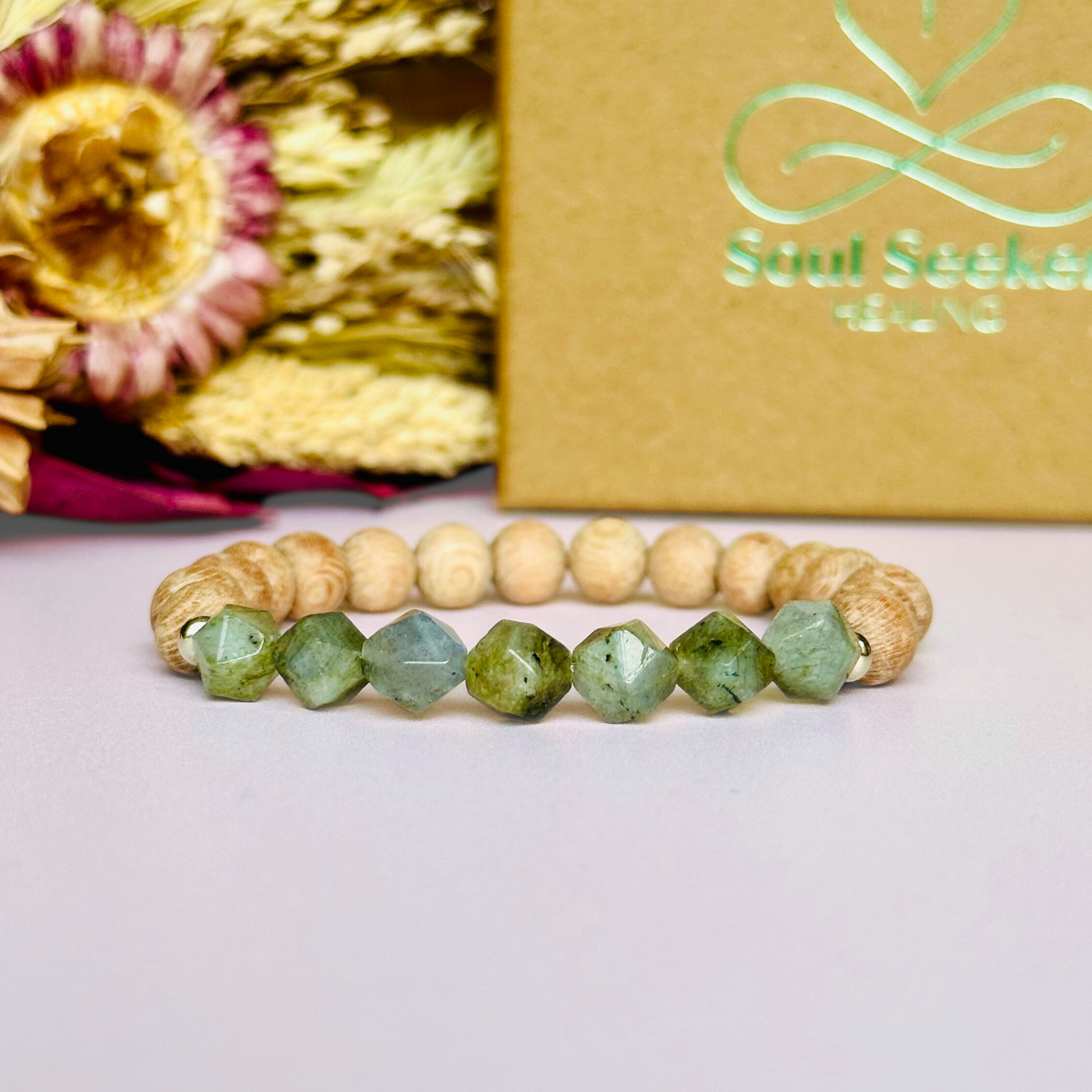 Labradorite and raw rosewood elasticated essential oil diffuser bracelet. Made with 8mm star cut labradorite beads, 8mm round raw rosewood beads and your choice of sterling silver, gold vermeil or rose gold vermeil spacer beads