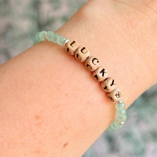 Bracelet featuring 5mm engraved wooden beads which you can personalise with your choice of words, numbers and symbols. The main the band of the bracelet is made with 4mm faceted green aventurine round crystal gemstone beads. Finished with your choice of gold vermeil, sterling silver or rose gold vermeil accent beads.