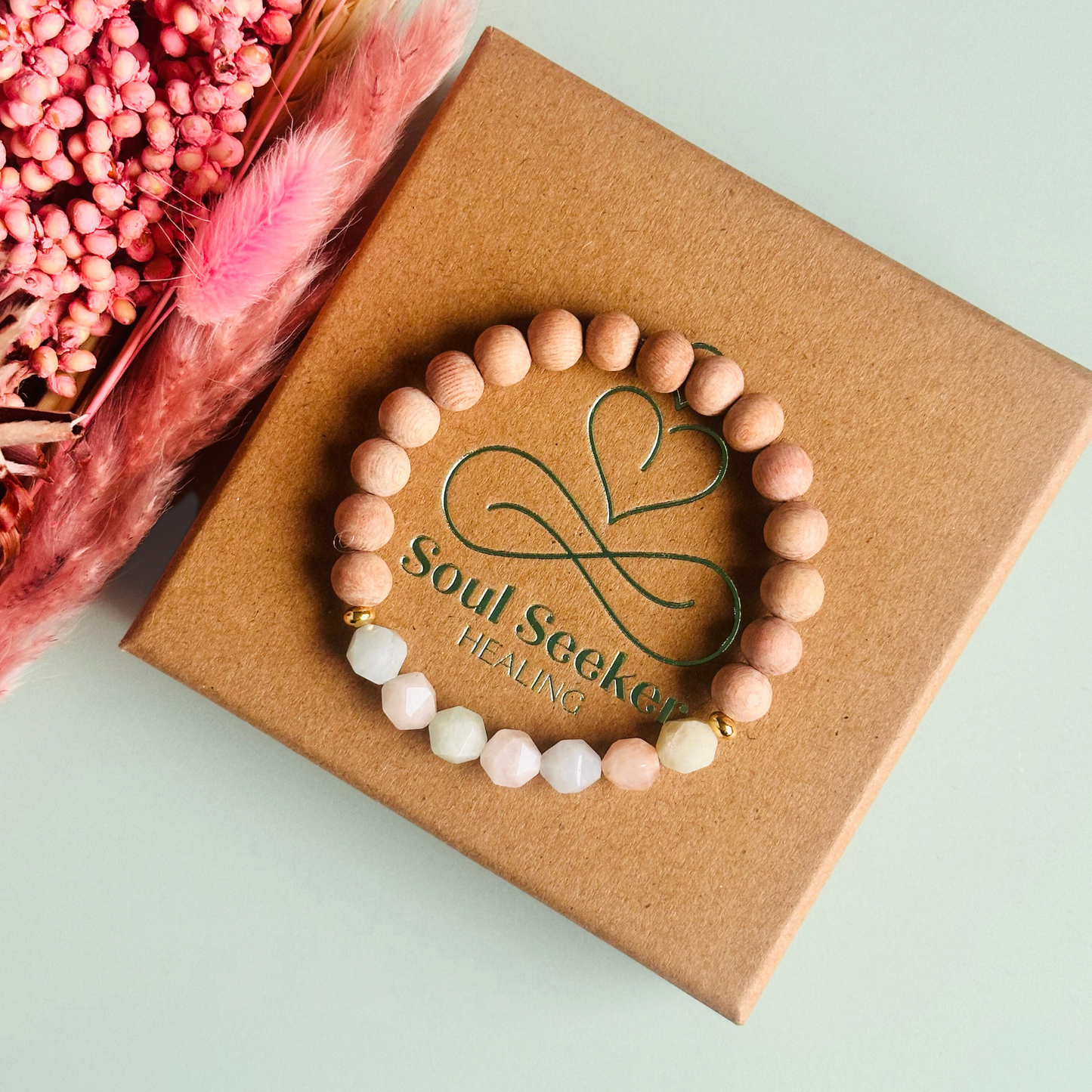 Morganite and raw rosewood elasticated essential oil diffuser bracelet. Made with 8mm star cut morganite beads, 8mm round raw rosewood beads and your choice of sterling silver, gold vermeil or rose gold vermeil spacer beads
