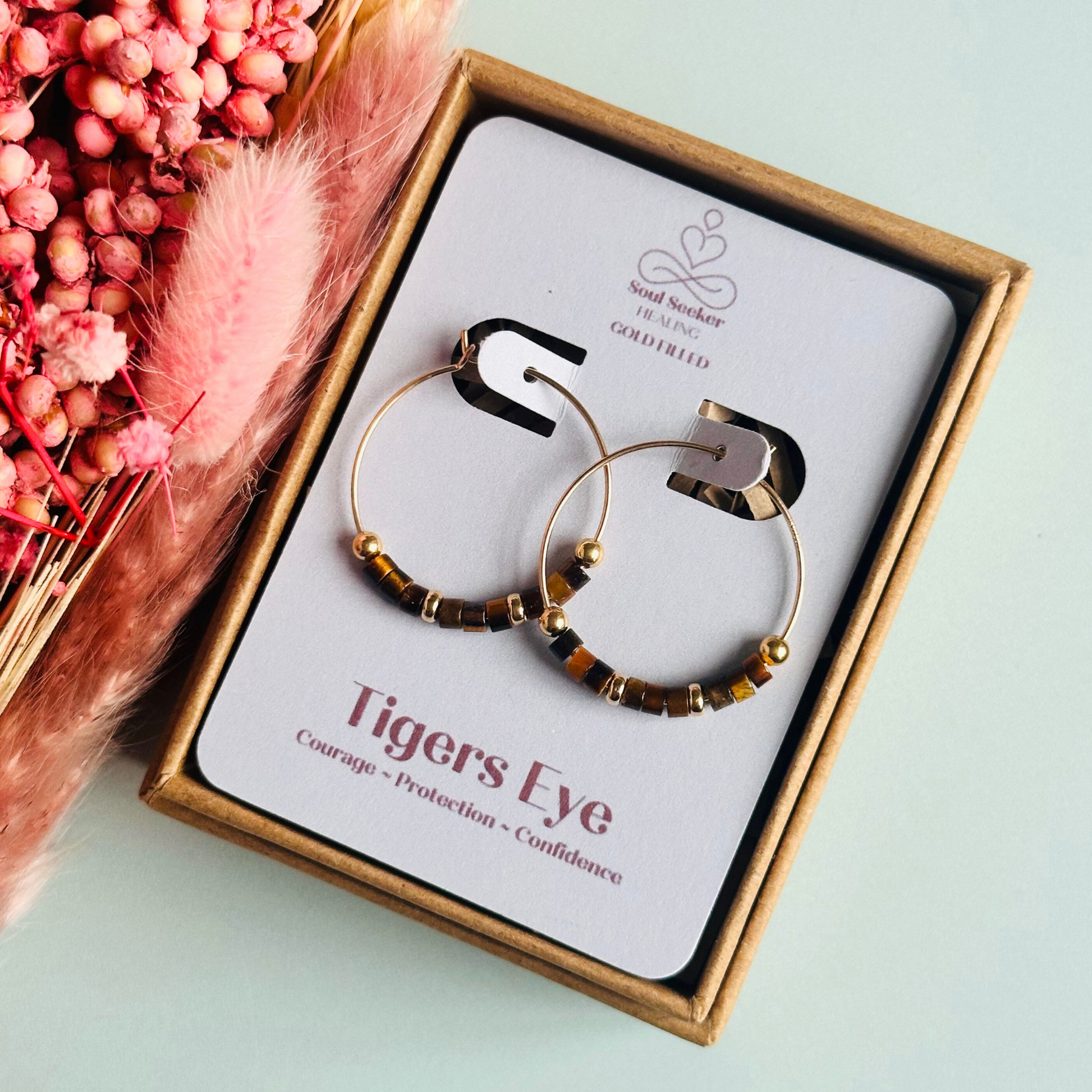 Tigers eye gold filled hoop earrings with ethically mined tigers eye heishi beads on 25mm gold filled hoops.
