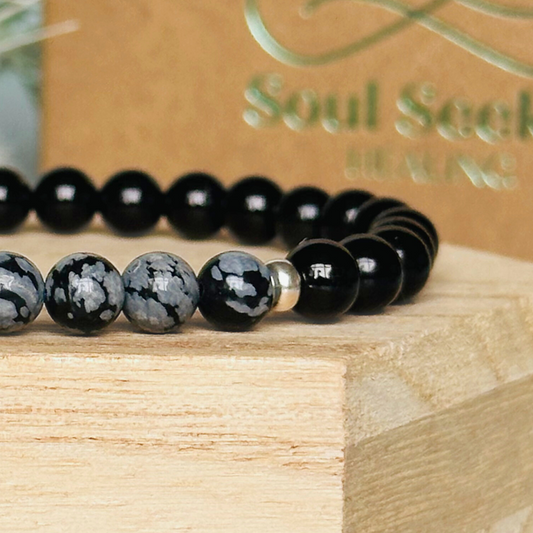 Men’s crystal bracelet featuring 6mm black tourmaline beads, 6mm snowflake obsidian beads with sterling silver spacer beads.