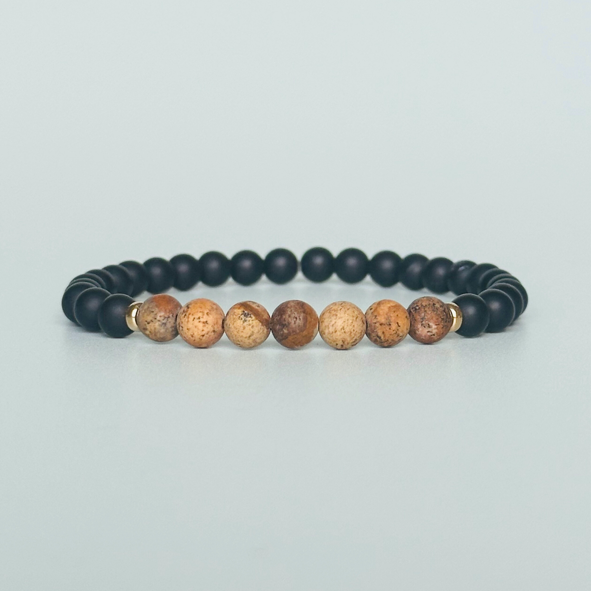 Men’s crystal bracelet featuring 6mm matte black onyx beads, 6mm matte picture jasper beads with gold vermeil spacer beads.