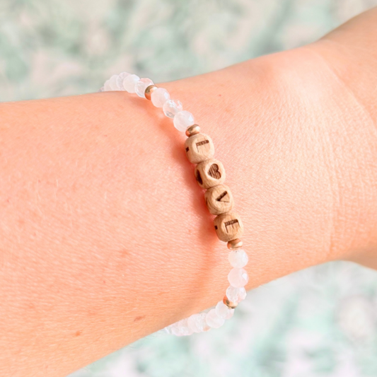 Bracelet featuring 5mm engraved wooden beads which you can personalise with your choice of words, numbers and symbols. The main the band of the bracelet is made with 4mm faceted rose quartz round crystal gemstone beads. Finished with your choice of gold vermeil, sterling silver or rose gold vermeil accent beads.