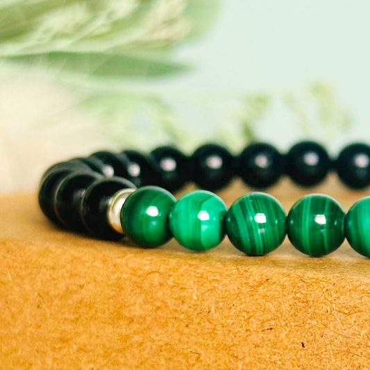 Mens crystal bracelet featuring 6mm black tourmaline beads with 6mm malachite beads, separated by two sterling silver spacer beads.