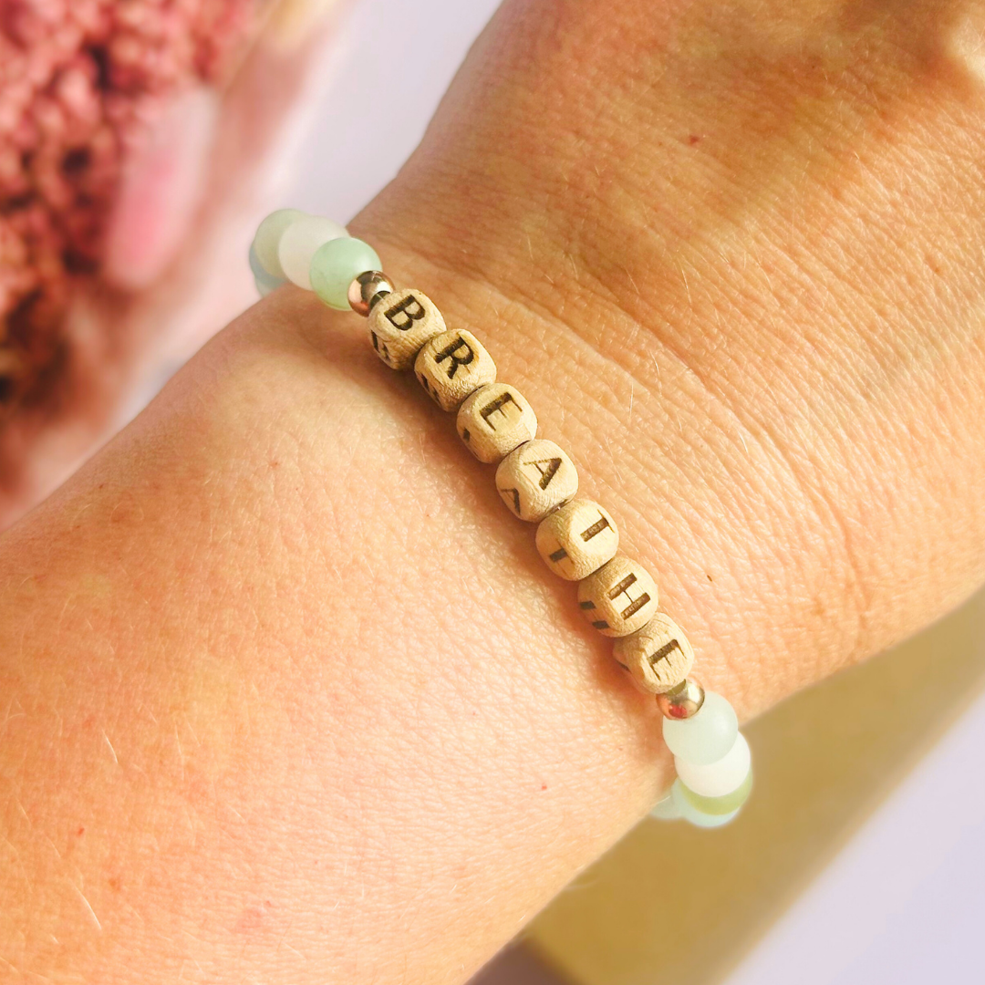 Breathwork bracelet featuring 6mm and 8mm frosted crystal beads that follow the 4-7-8 counted breathing method. Also featuring laser engraved wooden letter beads spelling out the word BREATHE. Choose your accent beads from rose gold vermeil, gold vermeil or sterling silver.