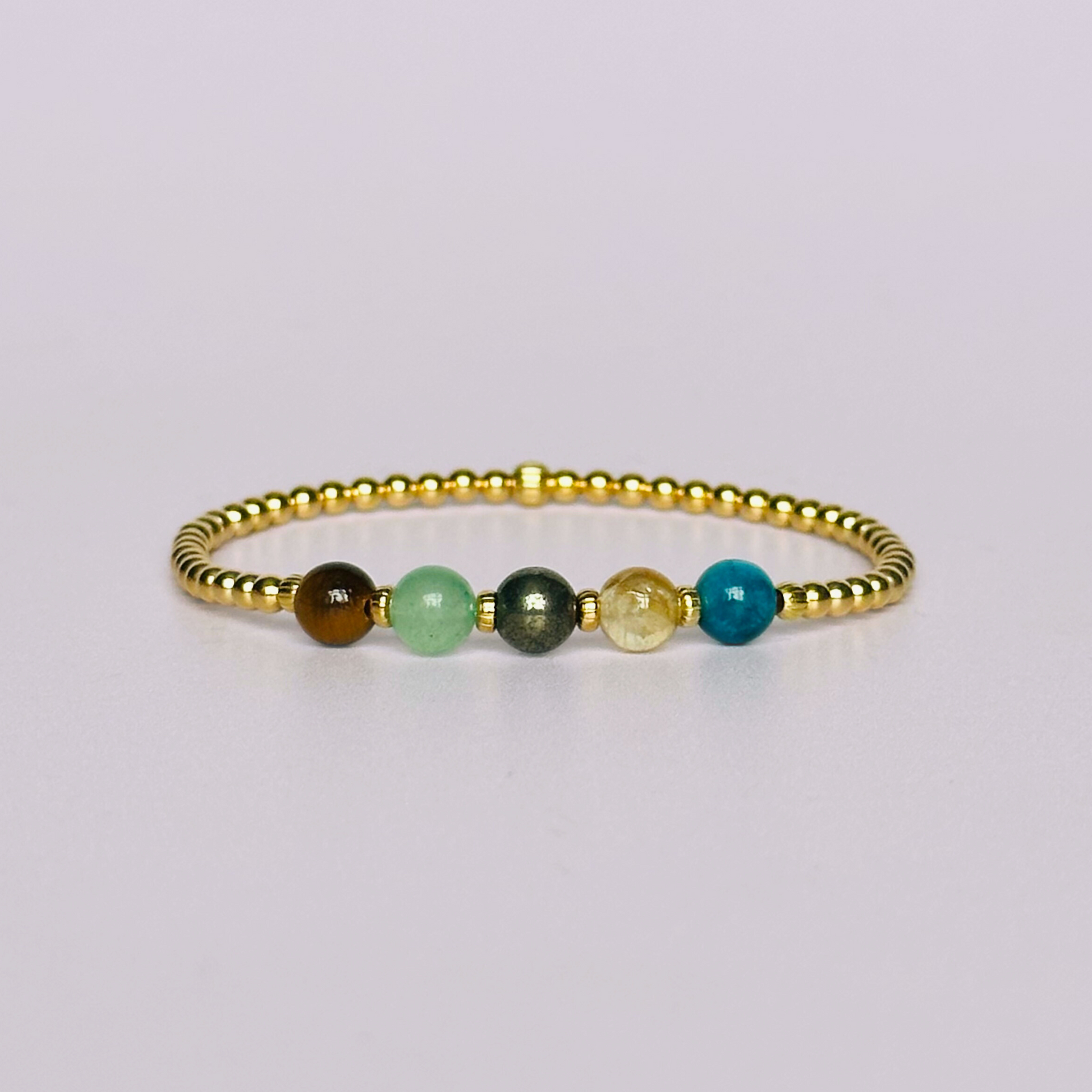 This gold vermeil manifesting bracelet is made with a selection of five healing crystals all believed to help achieve your dream life. The crystal beads are all 6mm and are on a band of 3mm gold vermeil beads with corrugated accent beads.