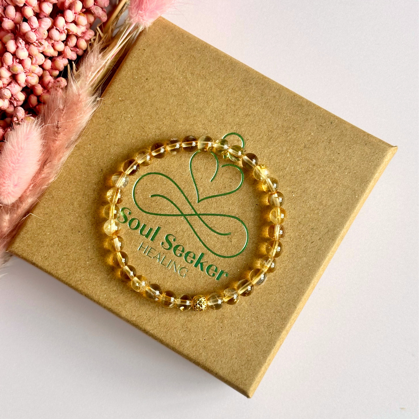 Citrine bracelet with a faceted sterling silver or gold vermeil focal bead. A bracelet to promote abundance and joy. Made with 6mm beads.