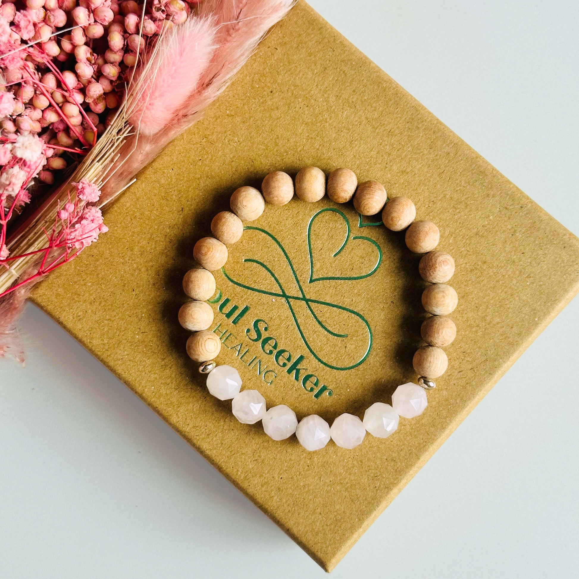 Rose quartz and raw rosewood elasticated essential oil diffuser bracelet. Made with 8mm star cut rose quartz beads, 8mm round raw rosewood beads and your choice of sterling silver, gold vermeil or rose gold vermeil spacer beads