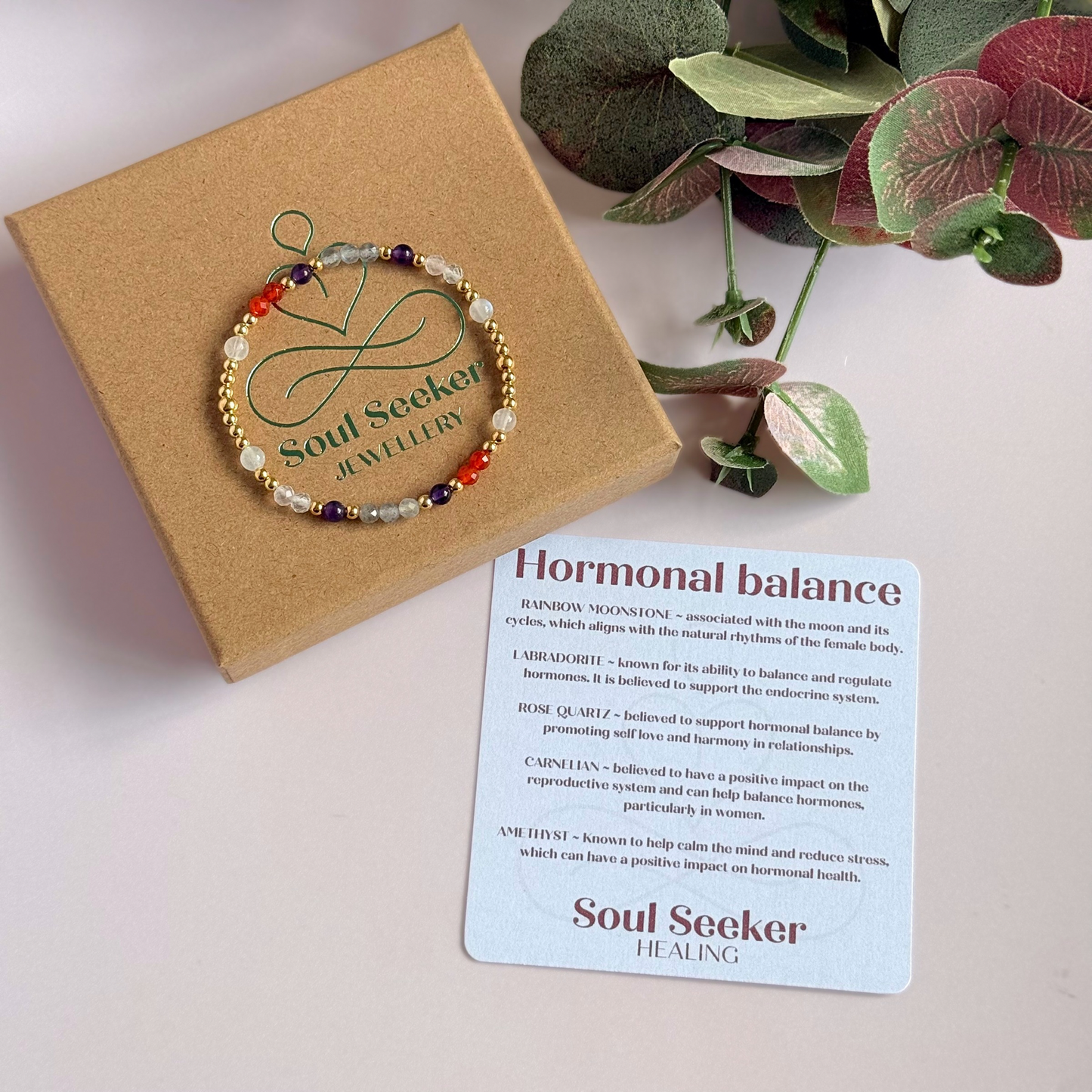 Dainty gold vermeil crystal bracelet featuring five crystals, in 4mm faceted and smooth round style, each believed to help with hormonal balance. Featuring amethyst, moonstone, carnelian, labradorite and rose quartz. Pictured in on the gift box with the information card..