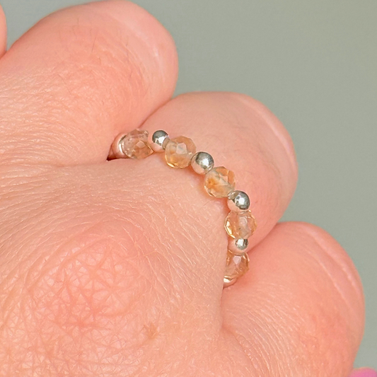 Sterling silver and citrine crystal ring. Made with 2.5mm sterling silver round beads and featuring five, 3mm faceted genuine citrine beads in a band style. Perfect for stacking. November birthstone jewellery