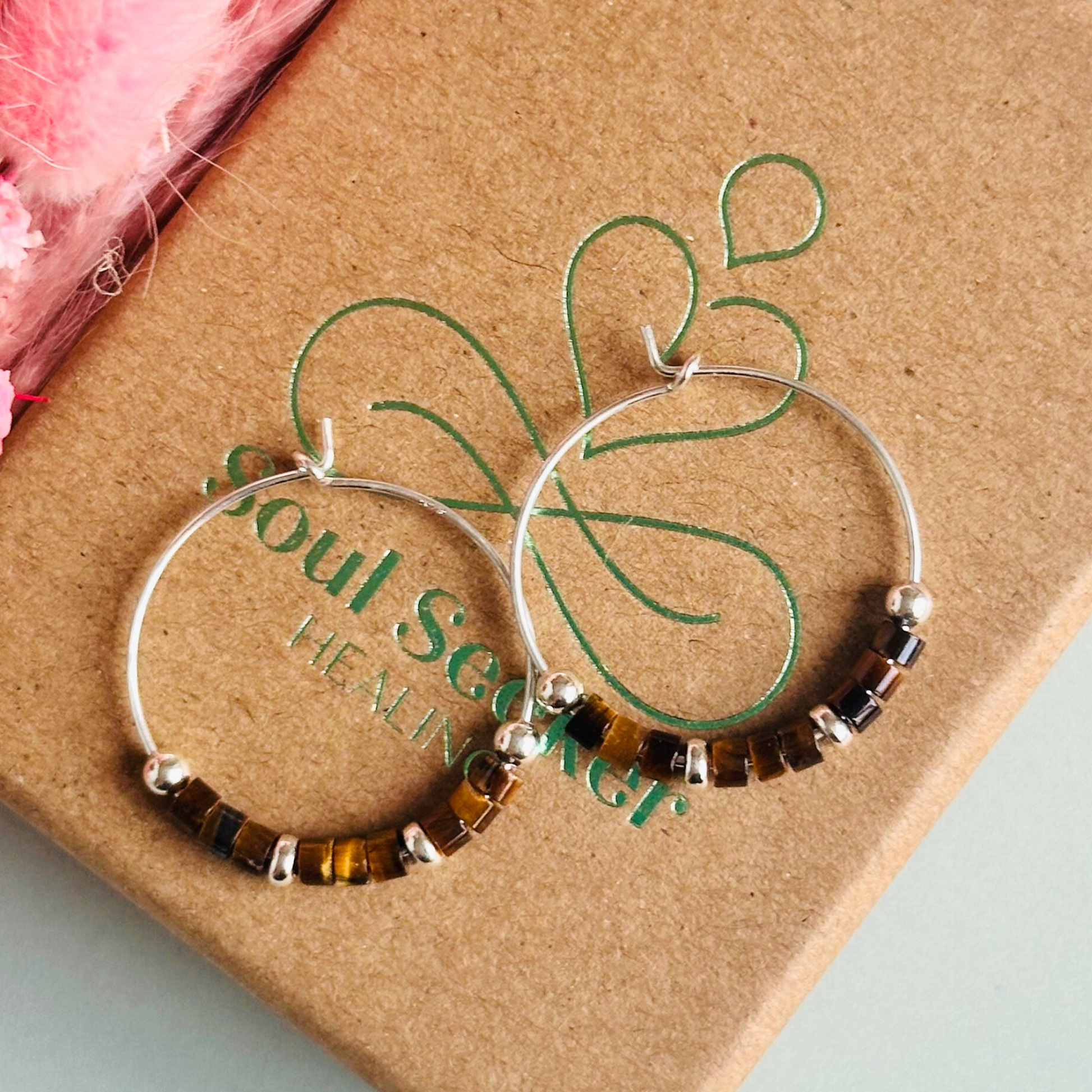 Tigers eye sterling silver hoop earrings with ethically mined tigers eye heishi beads on 25mm sterling silver hoops.