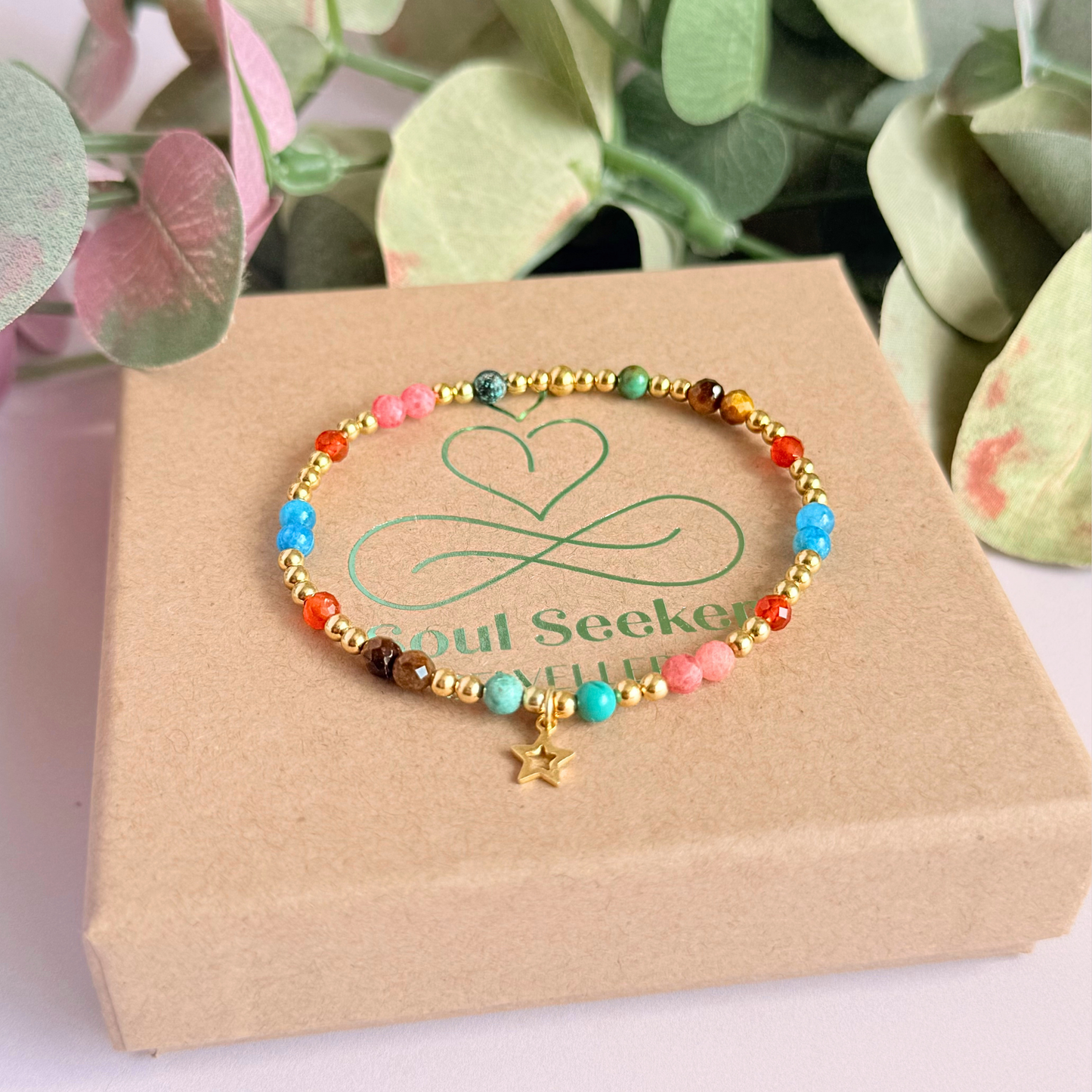 'Hot girl summer' gold vermeil dainty beaded bracelet with tigers eye, turquoise, apatite, carnelian and rhodochrosite. With a beautiful open star charm.Made with round 3mm gold vermeil beads and 4mm smooth and faceted round crystal gemstone beads. Pictured on the gift box.
