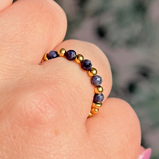 Gold vermeil and sapphire crystal ring. Made with 2.5mm gold vermeil round beads and featuring five, 3mm faceted genuine sapphire beads in a band style. Perfect for stacking. September birthstone jewellery