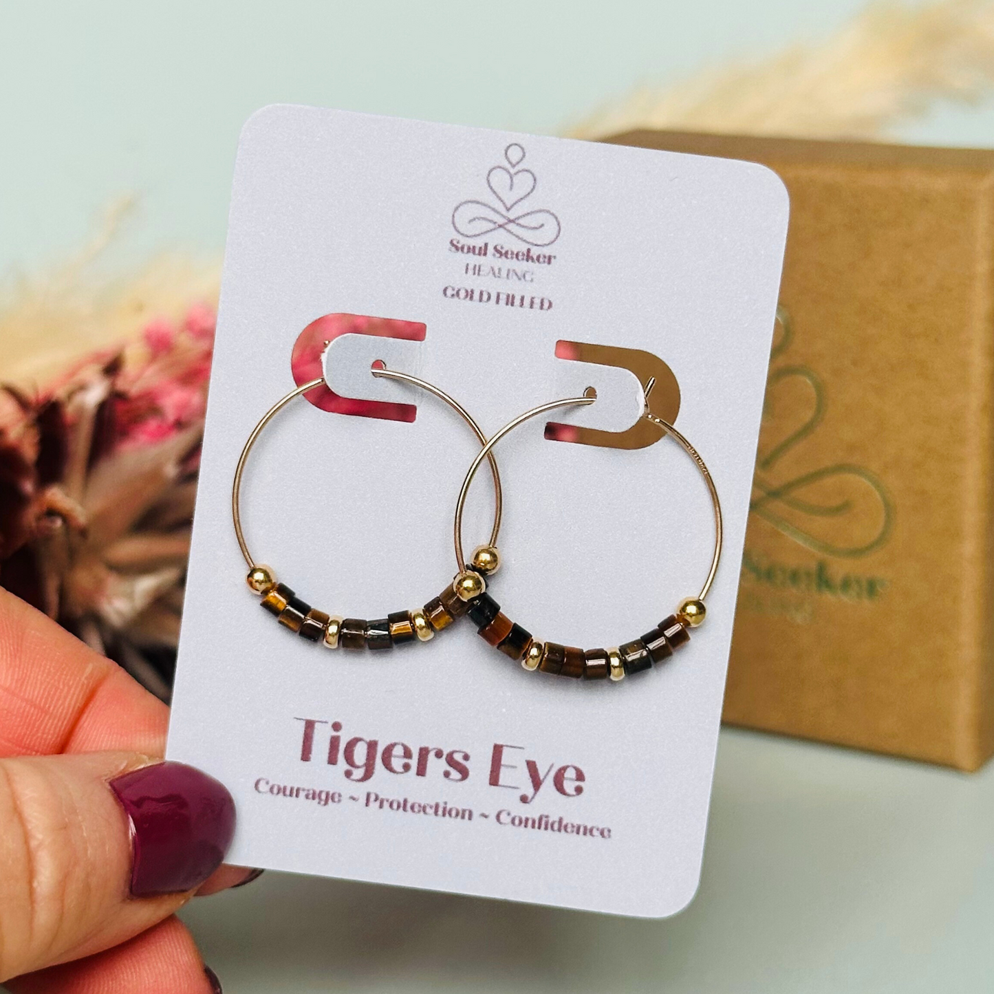 Tigers eye gold filled hoop earrings with ethically mined tigers eye heishi beads on 25mm gold filled hoops.