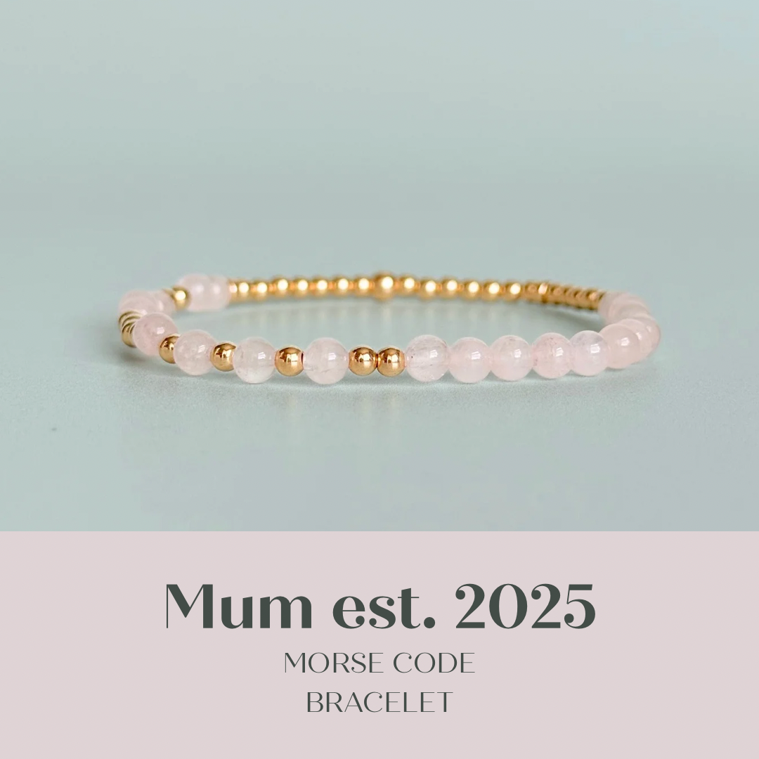 Morse code secret message bracelet spelling out the words Mum est. 2025 in gold filled and rose quartz crystal beads. elasticated with 4mm rose quartz beads and 3mm gold filled beads.