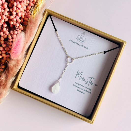 Moonstone necklace features a faceted moonstone teardrop bead on a delicate sterling silver figaro chain with a twisted sterling silver ring focal point. The necklace fastens with a subtle yet secure sterling silver bolt clasp. The teardrop bead measures 12mm x 8mm.