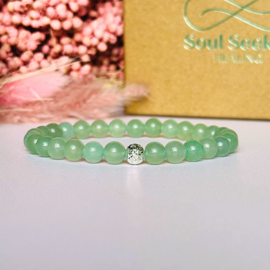 Green aventurine bracelet with a faceted sterling silver focal bead. A bracelet for prosperity, empathy, abundance and harmony. Made with 6mm beads.