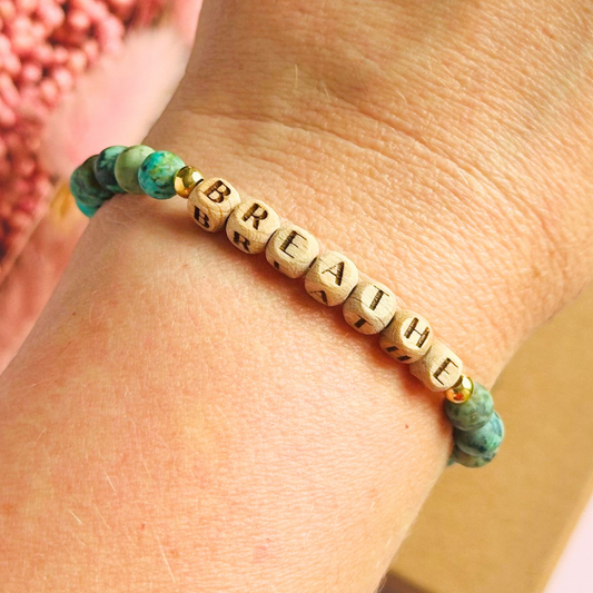 Breathwork bracelet featuring 6mm and 8mm frosted African turquoise crystal beads that follow the 4-7-8 counted breathing method. Also featuring laser engraved wooden letter beads spelling out the word BREATHE. Choose your accent beads from rose gold vermeil, gold vermeil or sterling silver.